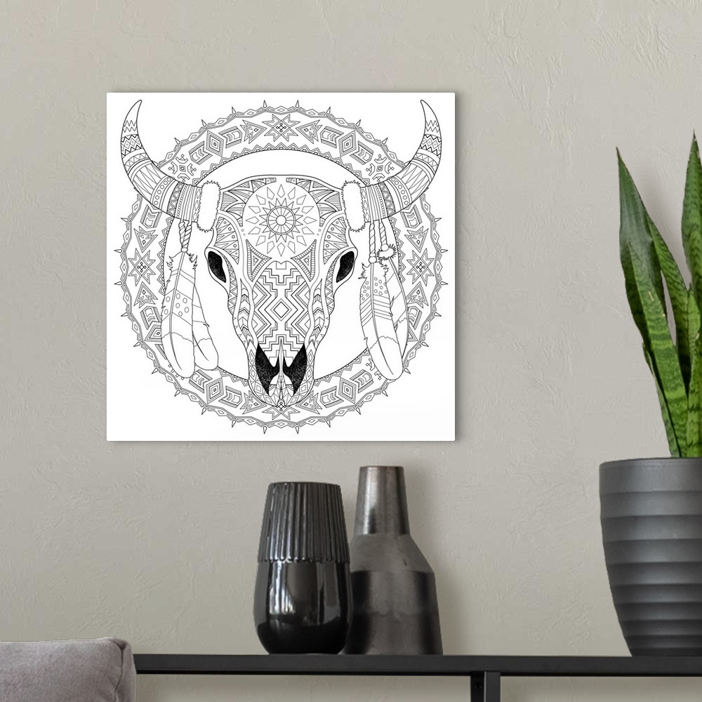 A modern room featuring Black and white line art of an intricately designed skull with horns and feathers.