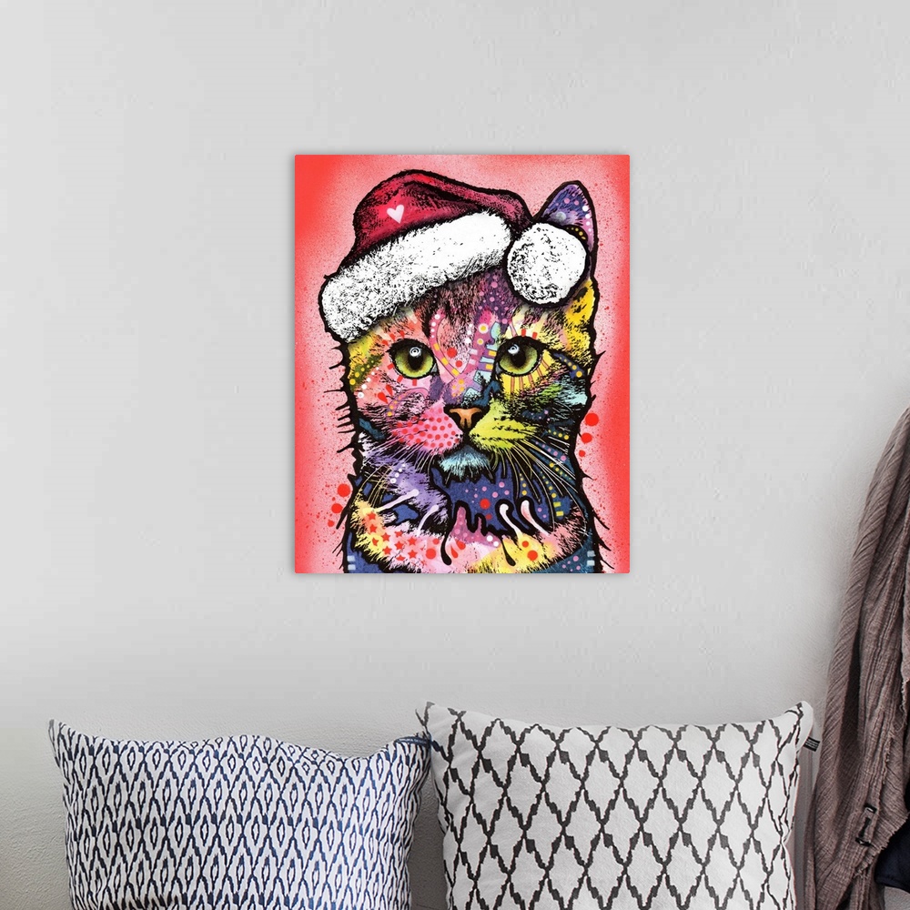 A bohemian room featuring Cute painting of a colorful kitten wearing Santa's hat on a red spray painted background.