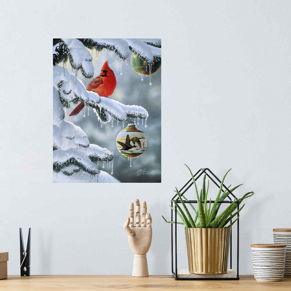 A bohemian room featuring A male cardinal sitting on a snow covered branch with a christmas ball, ornament hanging from the...