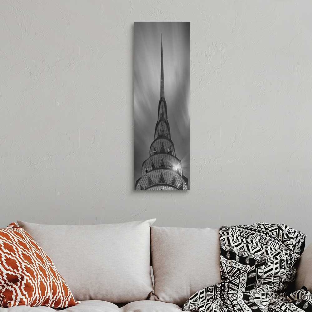 A bohemian room featuring A photograph of the Chrysler building taken in black and white.