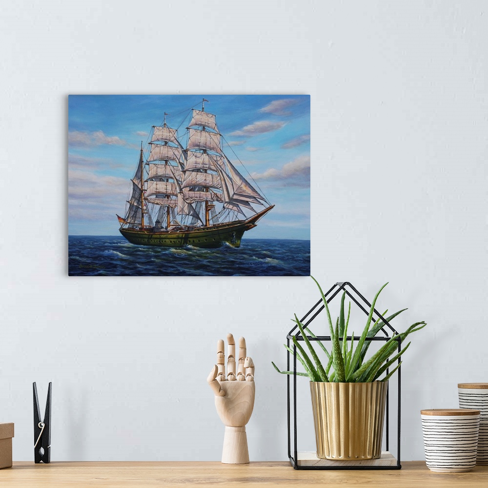 A bohemian room featuring Contemporary artwork of a large ship with several sails on the ocean.