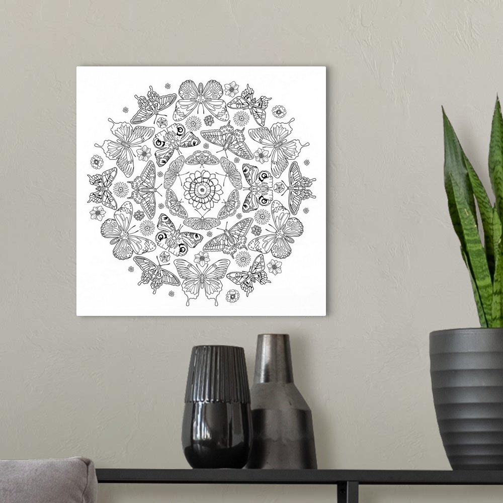 A modern room featuring Black and white line art of an intricately designed mandala made out of butterflies and flowers.