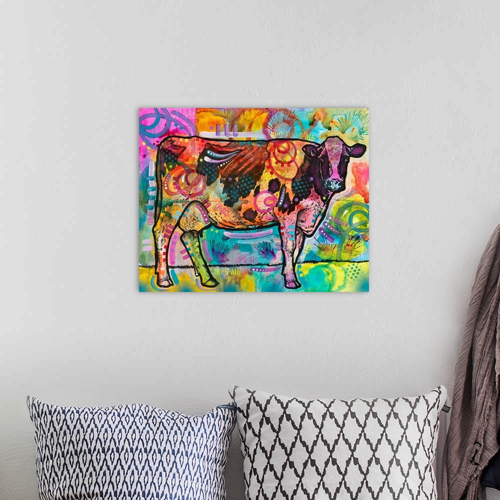 A bohemian room featuring Colorful painting of a cow looking straight at you with abstract designs all over.