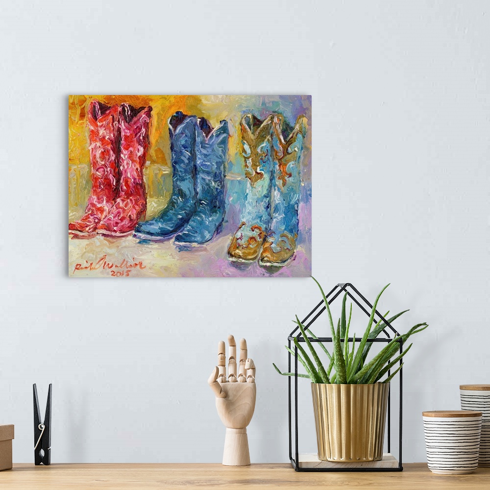 A bohemian room featuring Colorful abstract painting of three pairs of cowboy boots.
