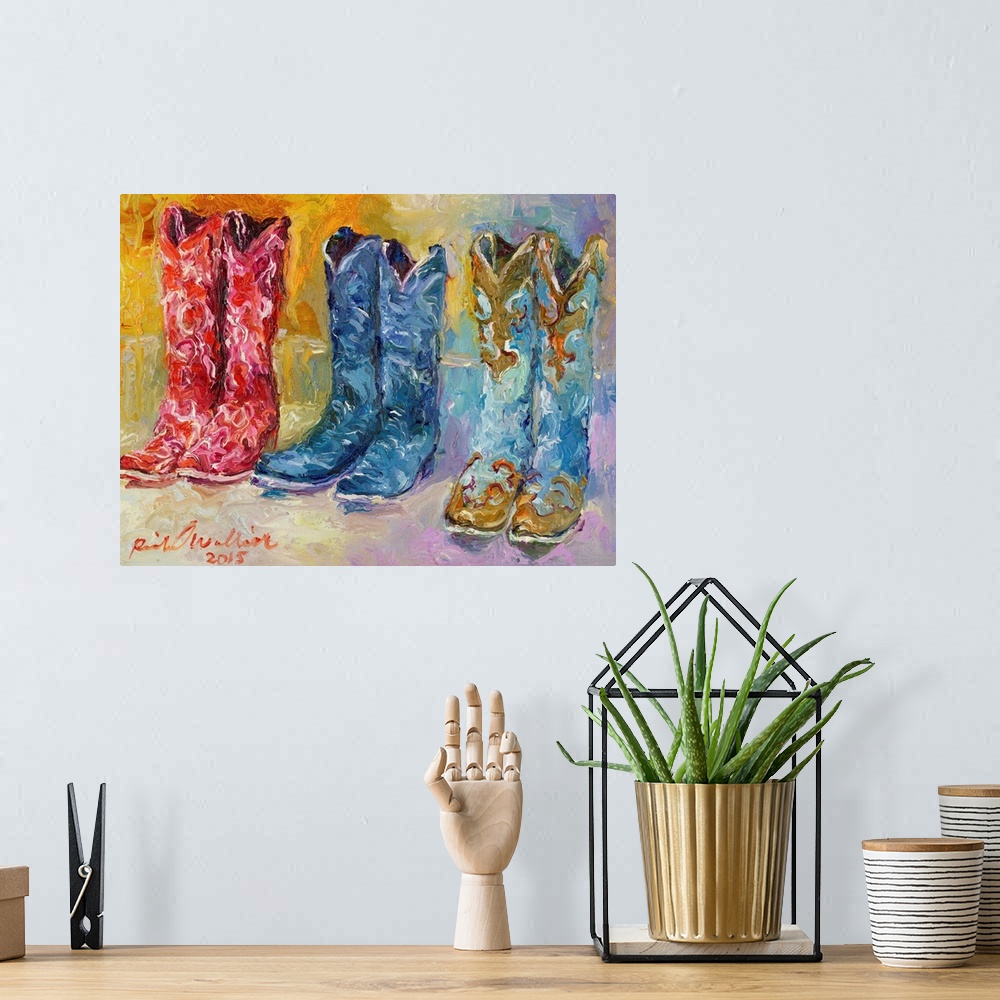 A bohemian room featuring Colorful abstract painting of three pairs of cowboy boots.