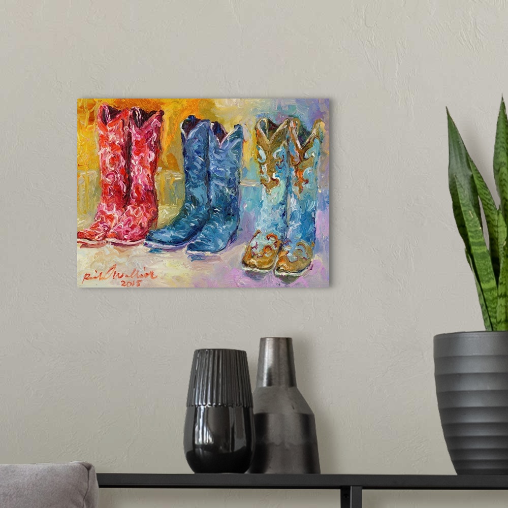 A modern room featuring Colorful abstract painting of three pairs of cowboy boots.