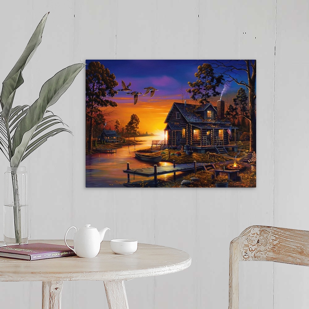 A farmhouse room featuring An idyllic painting of a cottage in the countryside at sunset.