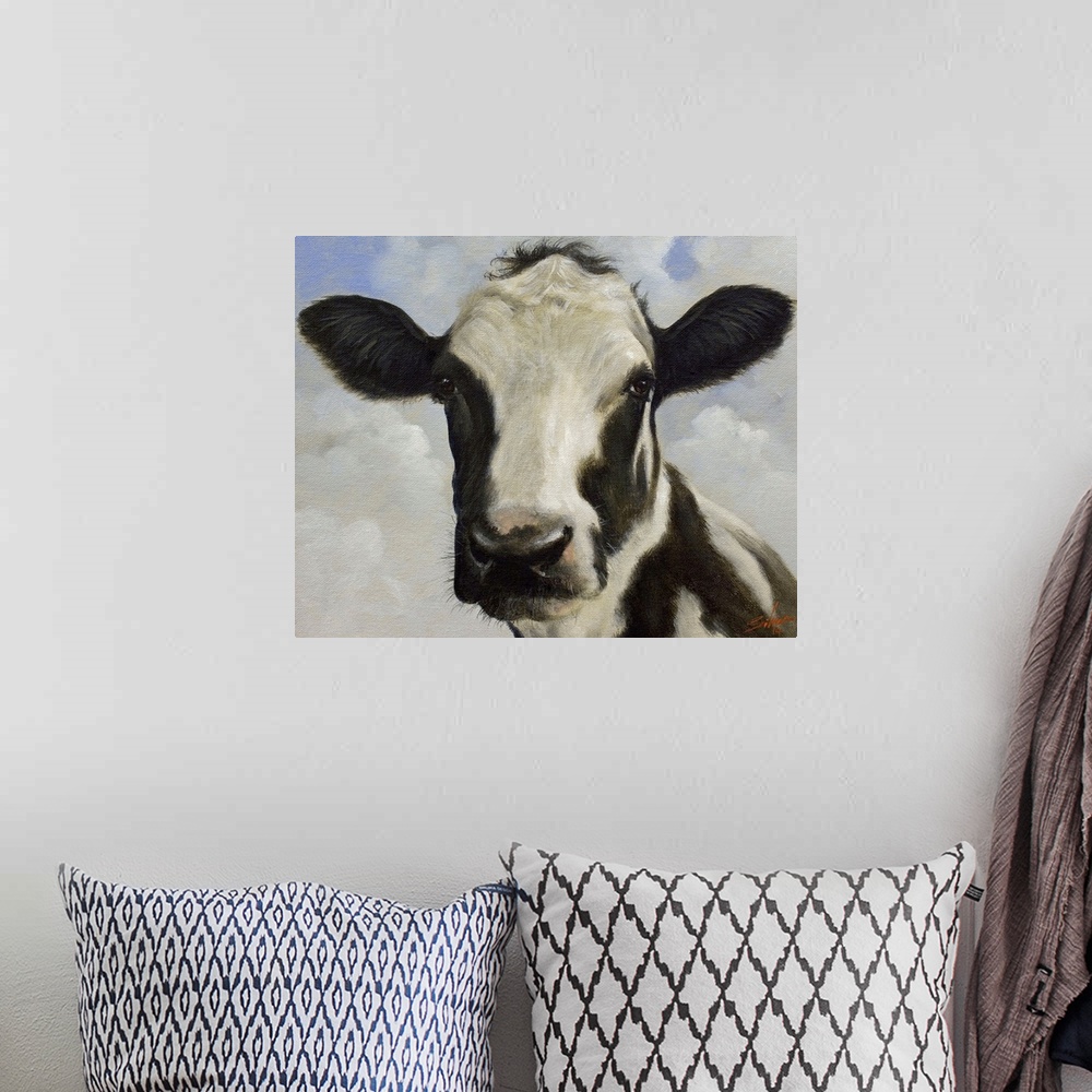A bohemian room featuring Contemporary painting of a black and white cow.