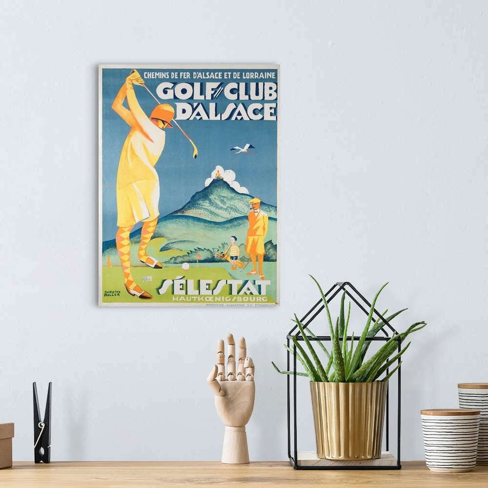 A bohemian room featuring Vintage advertisement artwork for Golf Club D'Alsace.