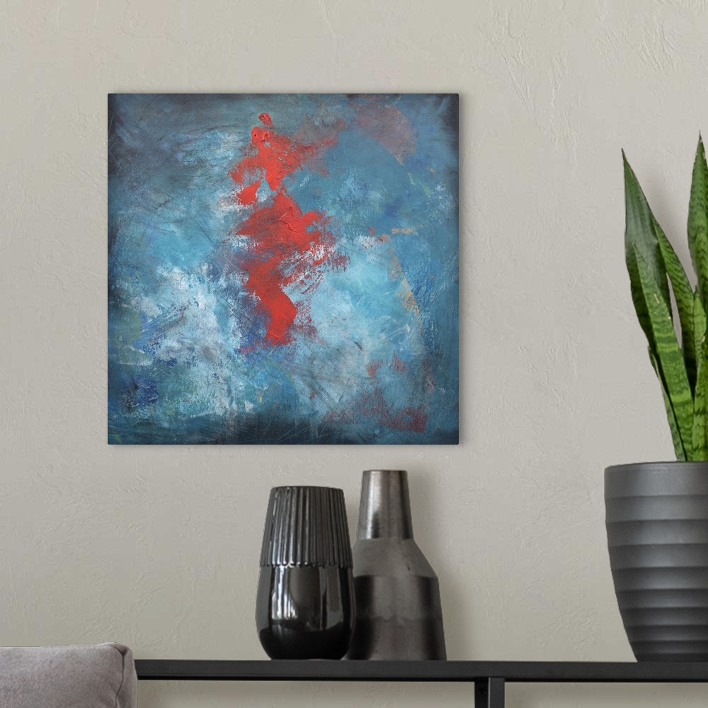 A modern room featuring Abstract contemporary painting with a large red center on blue.