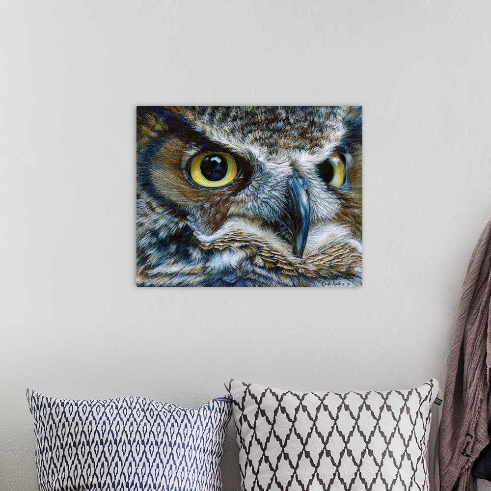 A bohemian room featuring Contemporary artwork of a close-up look of an owl face.
