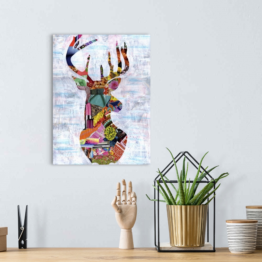 A bohemian room featuring Multimedia collage of magazine clippings and paint of the head and antlers of a buck.