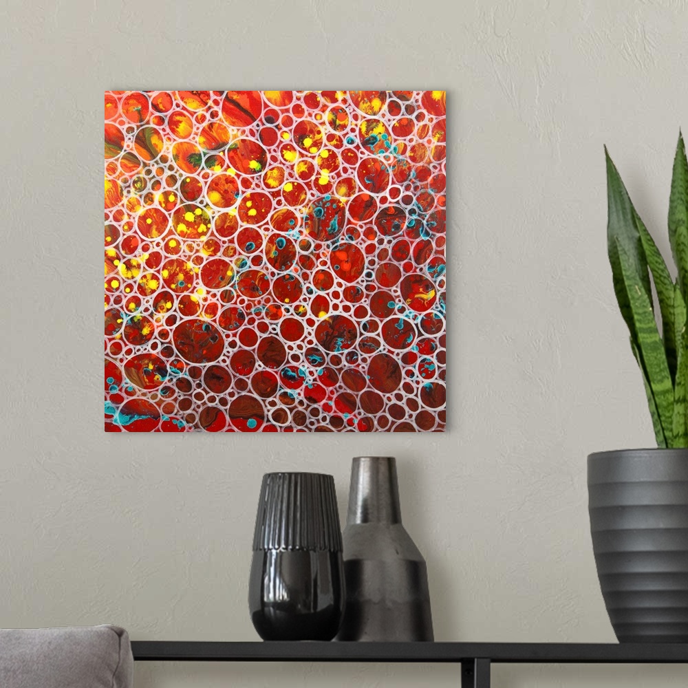 A modern room featuring A contemporary abstract painting of a saturated clustering of what resembles air bubbles with vib...