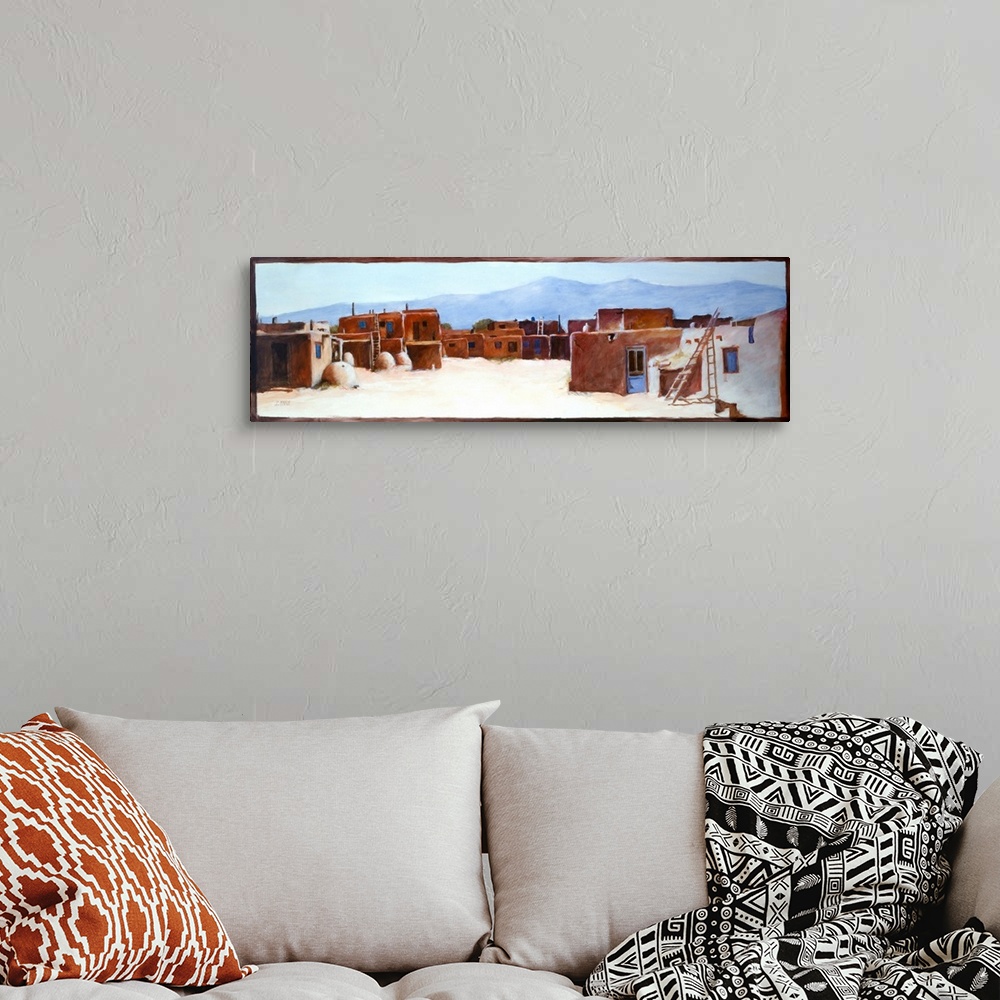 A bohemian room featuring Contemporary western theme painting of a southwestern village.