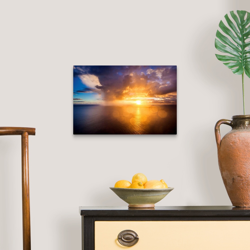 A traditional room featuring A photograph of a Hawaiian sunset over the ocean.