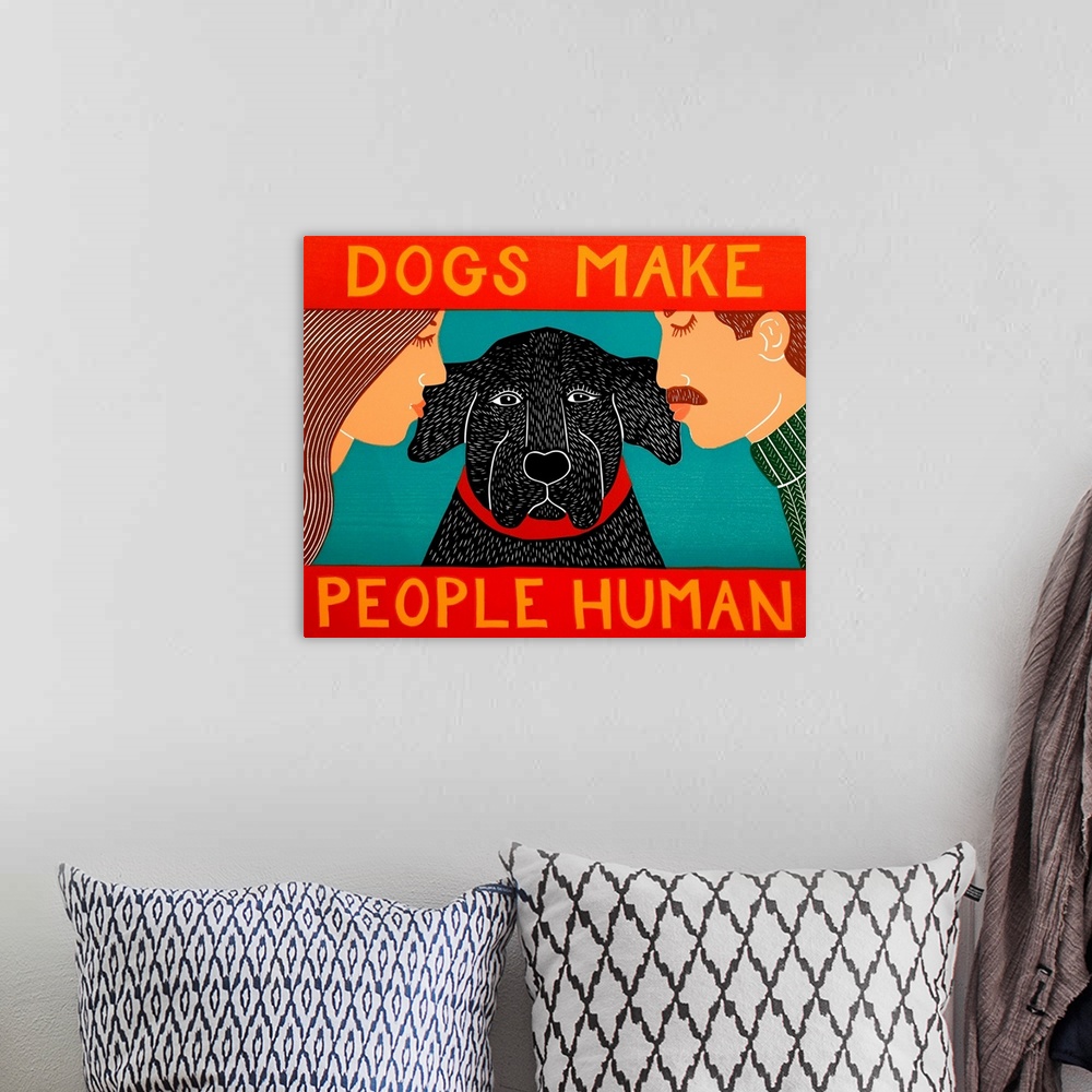 A bohemian room featuring Illustration of a man and a woman kissing their black lab on each ear with the phrase "Dogs Make ...