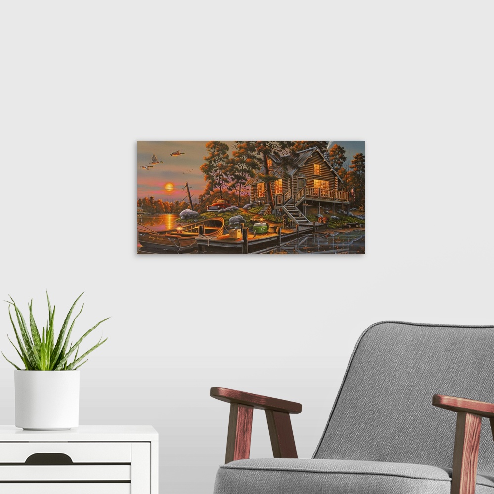 A modern room featuring An idyllic painting of a wilderness scene of a cabin on a lake.
