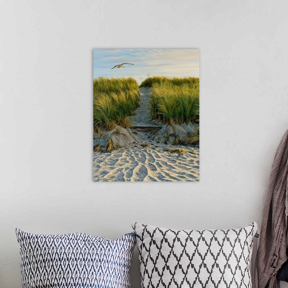 A bohemian room featuring Contemporary artwork of a seagull flying over a path through grassy sand dunes.