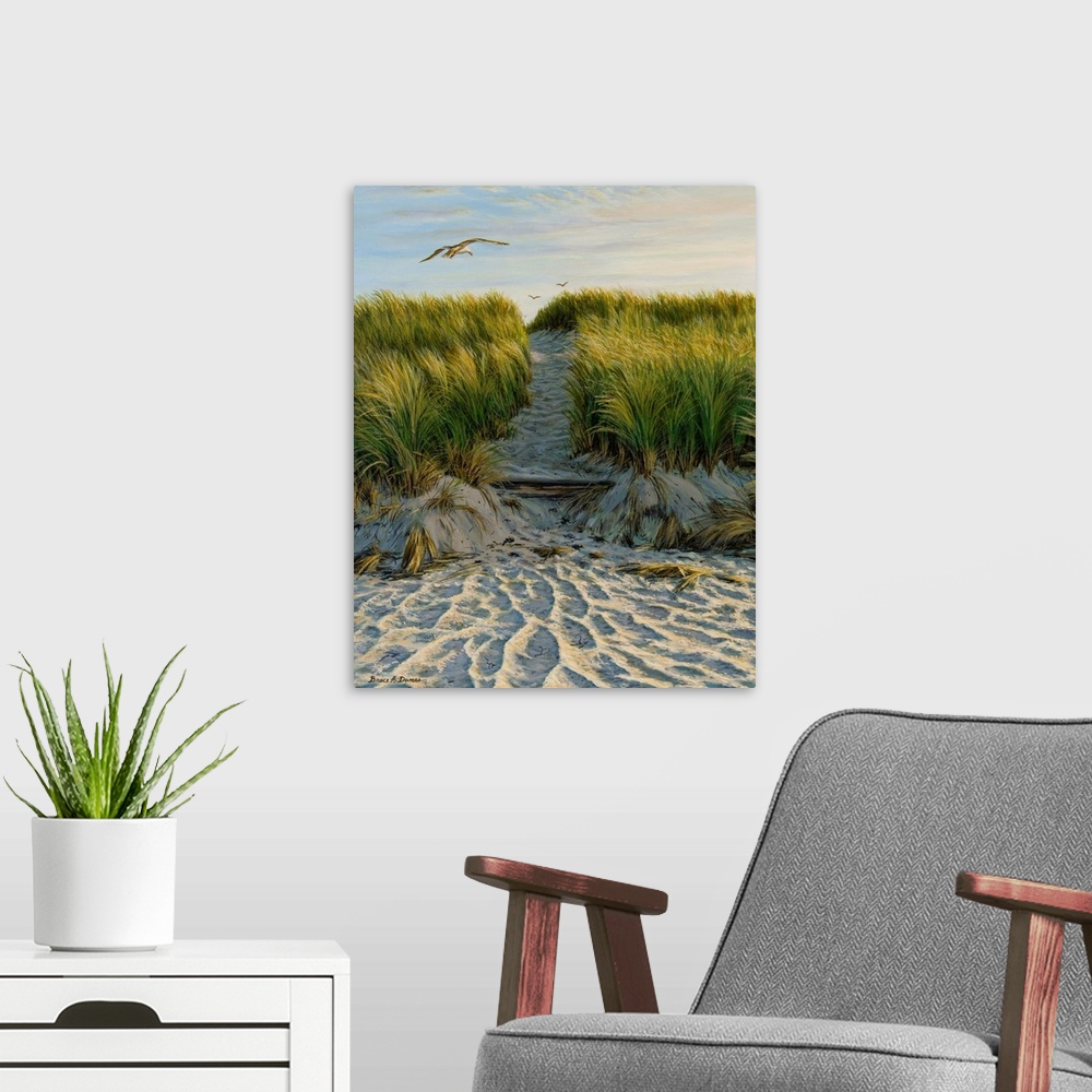 A modern room featuring Contemporary artwork of a seagull flying over a path through grassy sand dunes.