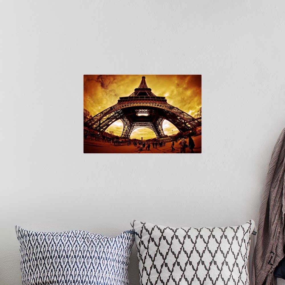 A bohemian room featuring Orange lit clouds surrounding Eiffel Tower, fisheye view