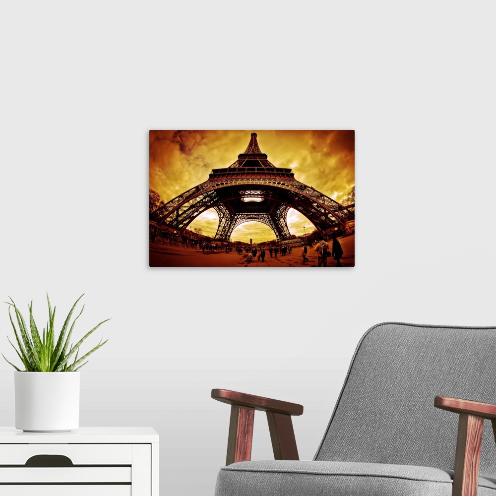 A modern room featuring Orange lit clouds surrounding Eiffel Tower, fisheye view