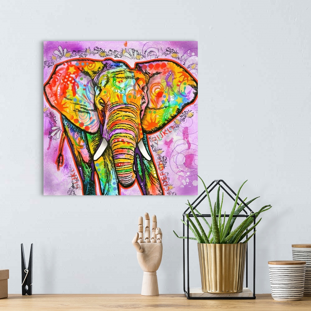 A bohemian room featuring Square painting of a colorful elephant with abstract markings on a busy purple background.