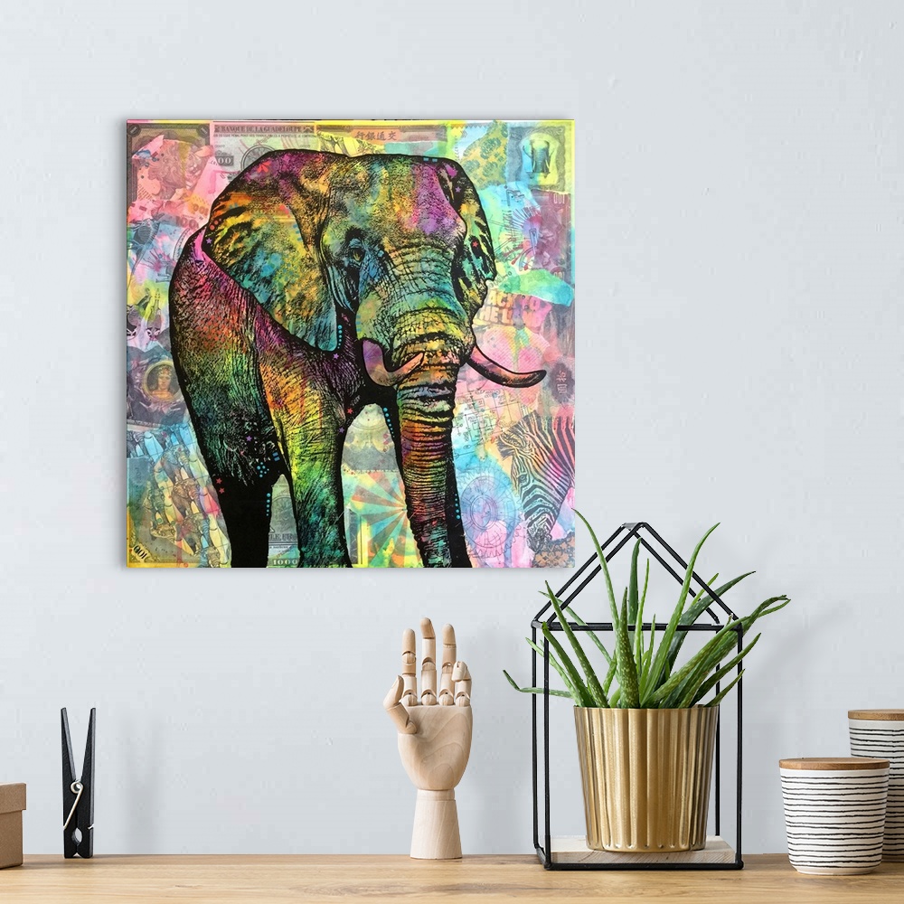 A bohemian room featuring Square illustration of a colorful elephant on top of a collage of African image themed cut outs.