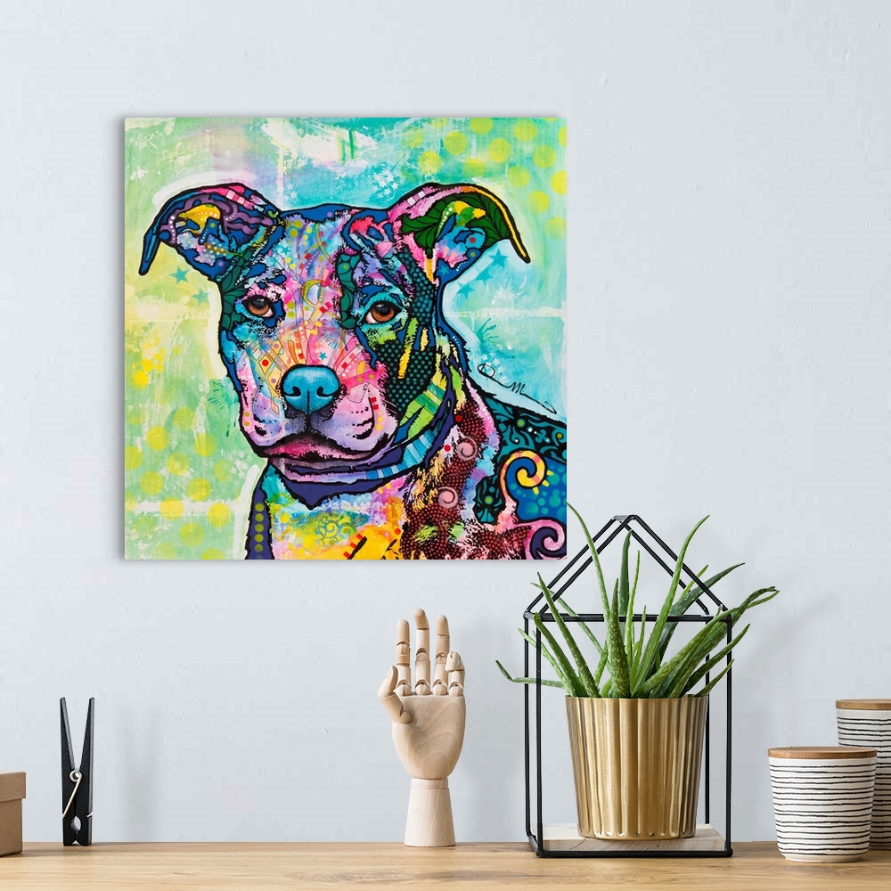 A bohemian room featuring Square art with an illustration of a pit bull with colorful abstract designs all over.