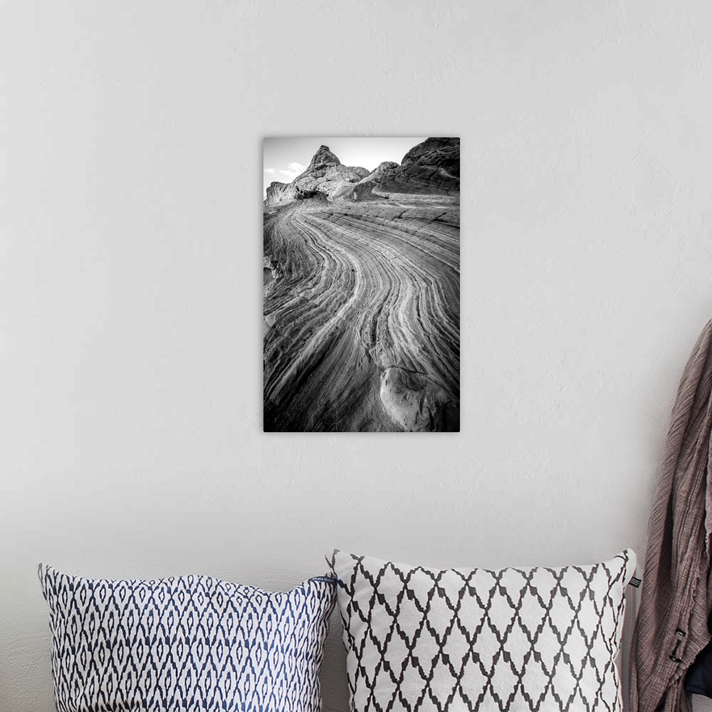 A bohemian room featuring Black and white photograph highlighting the textures from the layers of rock.
