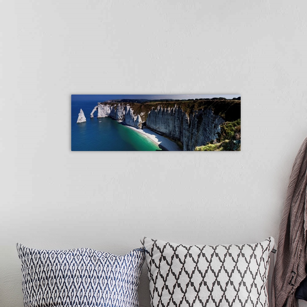 A bohemian room featuring Panoramic photograph of the cliffs at Etretat, France.