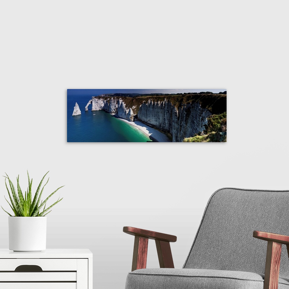 A modern room featuring Panoramic photograph of the cliffs at Etretat, France.