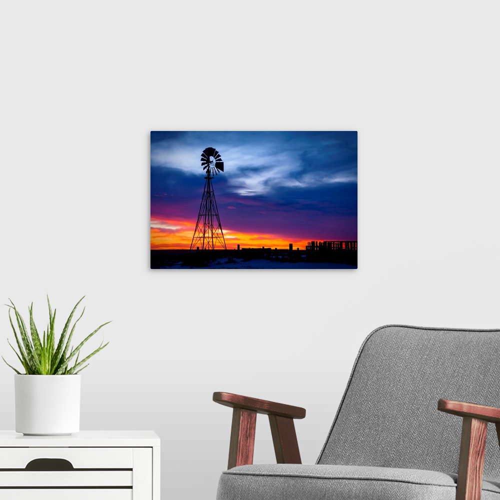 A modern room featuring Windmill on a farm at sunrise, color photography
