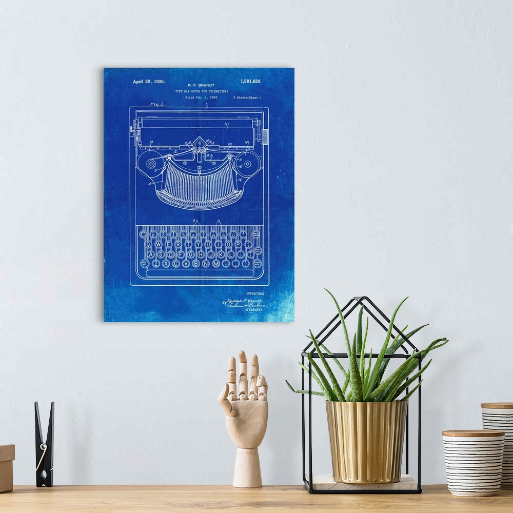A bohemian room featuring Faded Blueprint Dayton Portable Typewriter Patent Poster