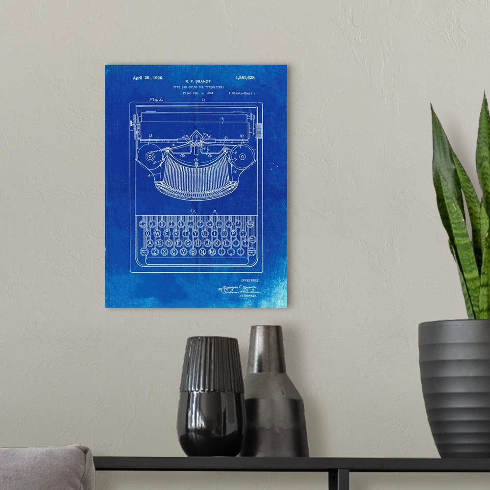 A modern room featuring Faded Blueprint Dayton Portable Typewriter Patent Poster
