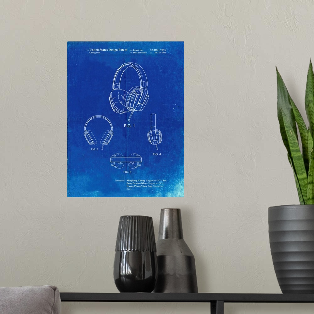 A modern room featuring Faded Blueprint Headphones Patent Poster