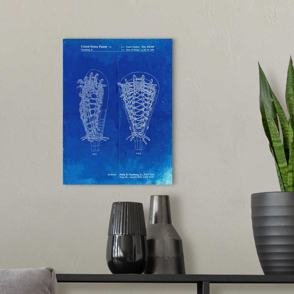 A modern room featuring Faded Blueprint Lacrosse Stick Patent Poster