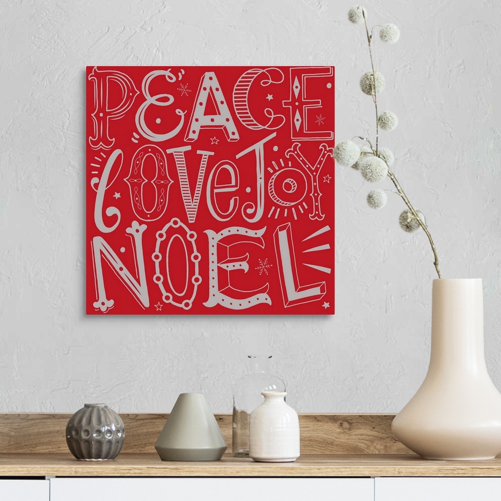 A farmhouse room featuring Holiday themed typography art with festive lettering against a red background.