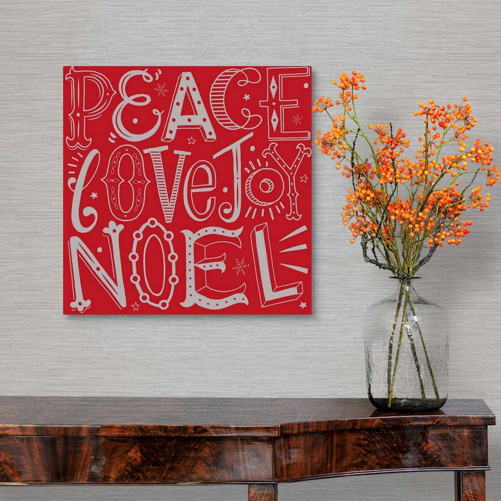 A traditional room featuring Holiday themed typography art with festive lettering against a red background.