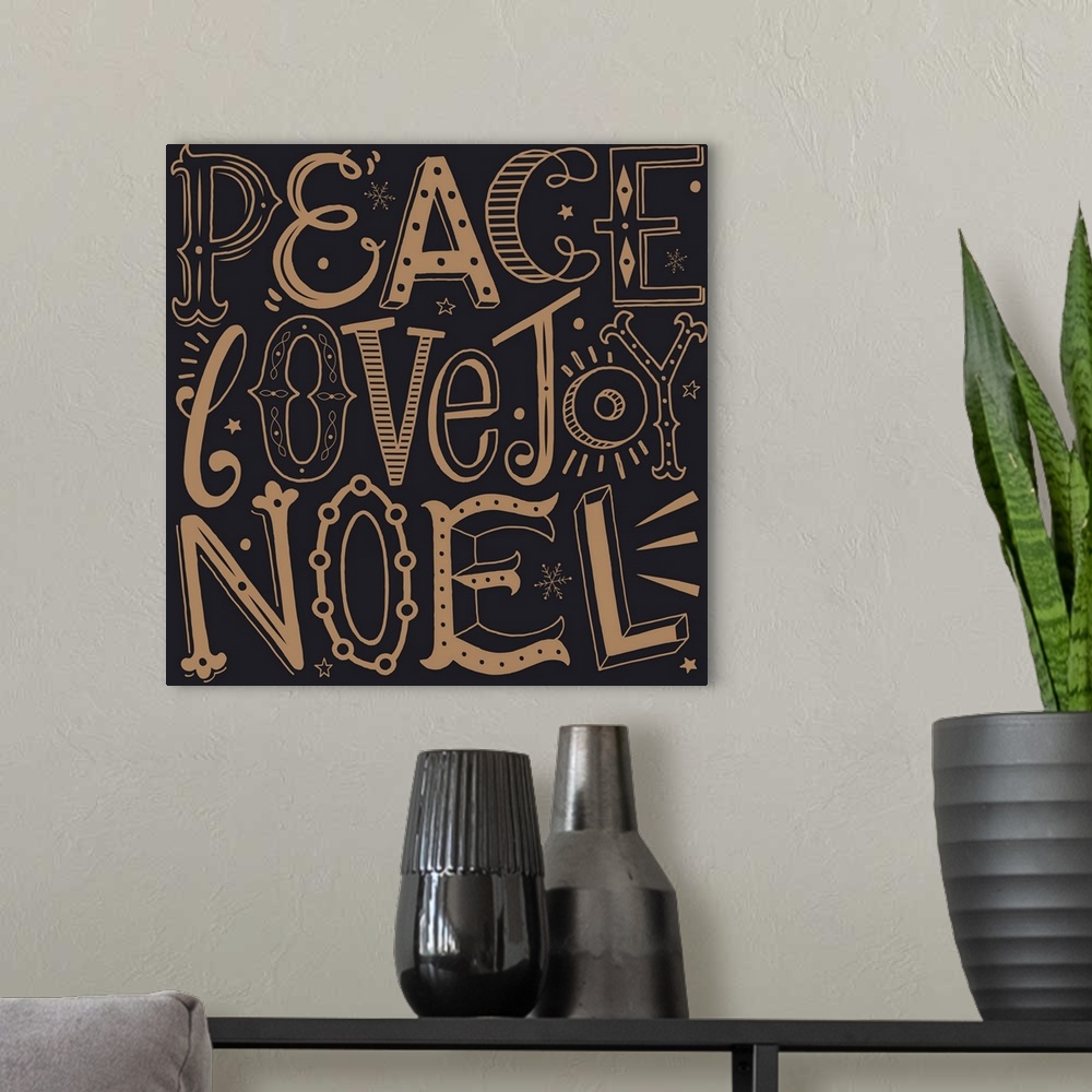 A modern room featuring Holiday themed typography art with festive lettering against a dark background.