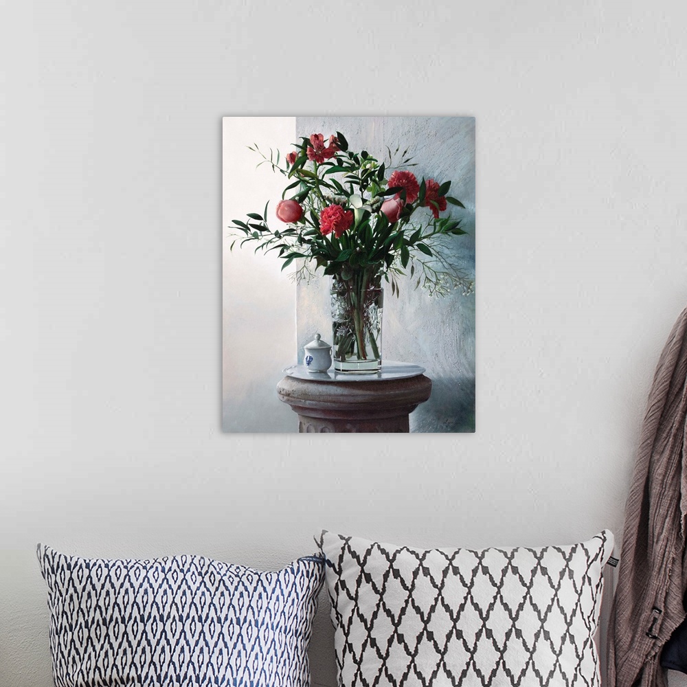 A bohemian room featuring Contemporary still life painting of a tall vase holding irises, carnations, and gerberas.