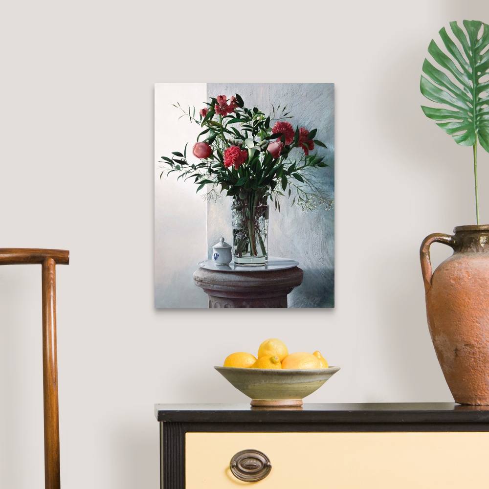 A traditional room featuring Contemporary still life painting of a tall vase holding irises, carnations, and gerberas.
