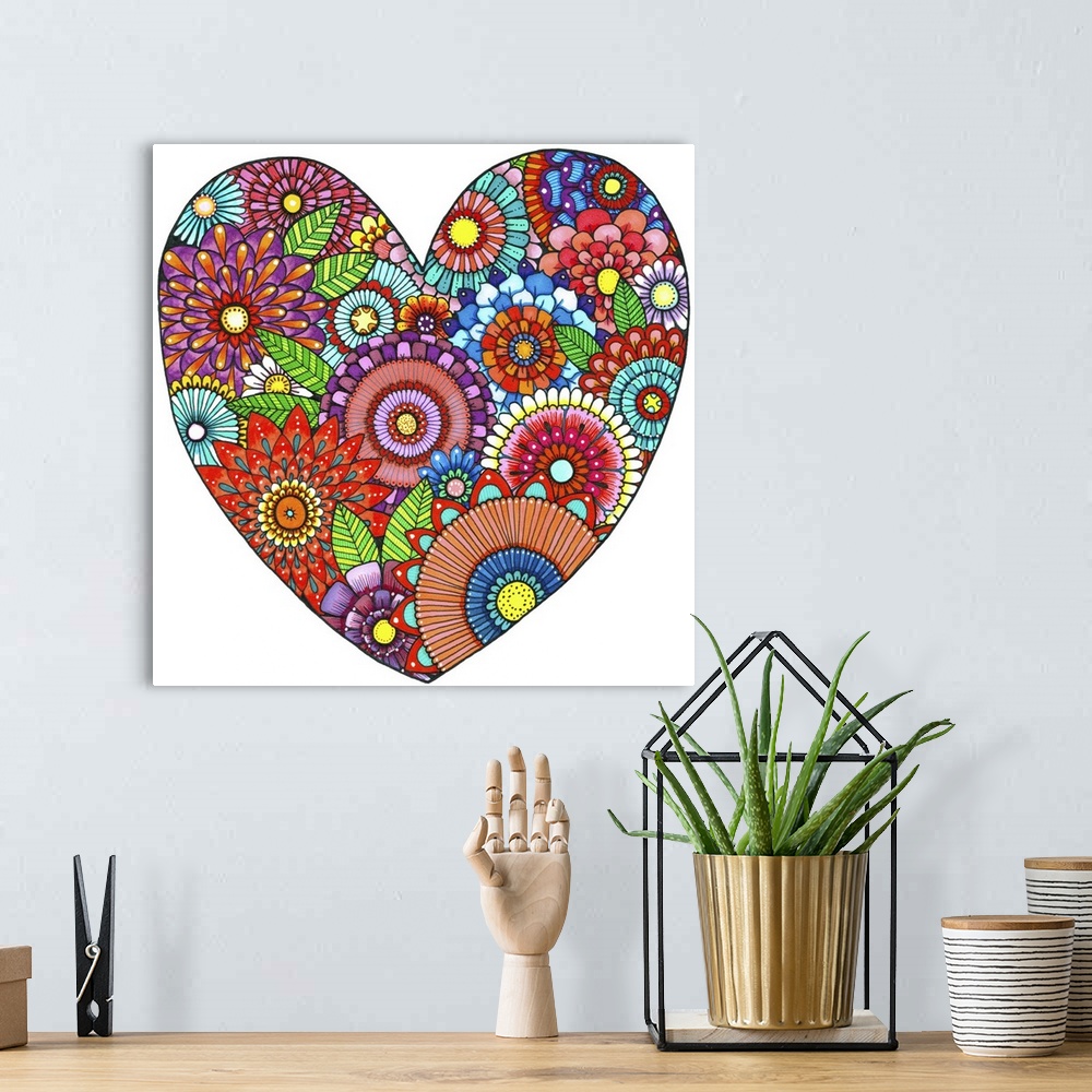 A bohemian room featuring Contemporary abstract artwork of bright vibrant colored flowers in a heart shape.