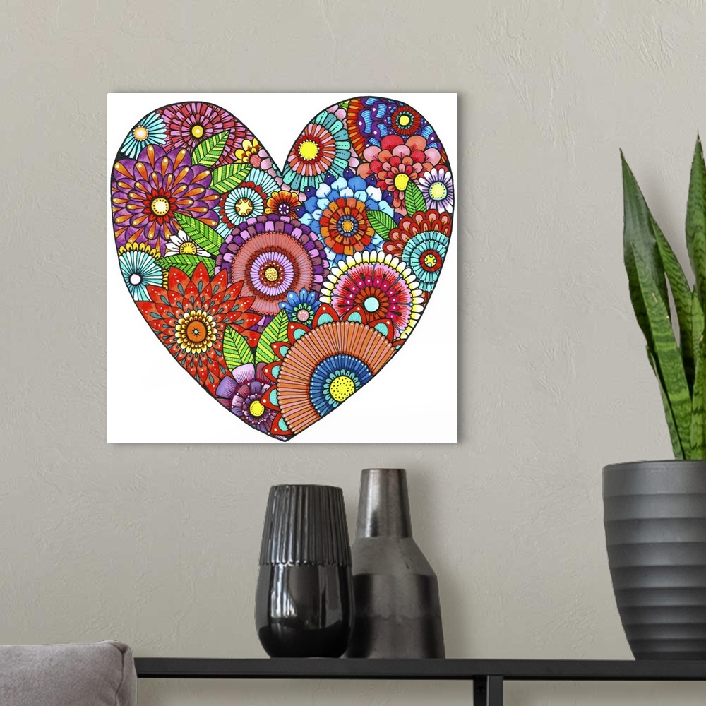 A modern room featuring Contemporary abstract artwork of bright vibrant colored flowers in a heart shape.