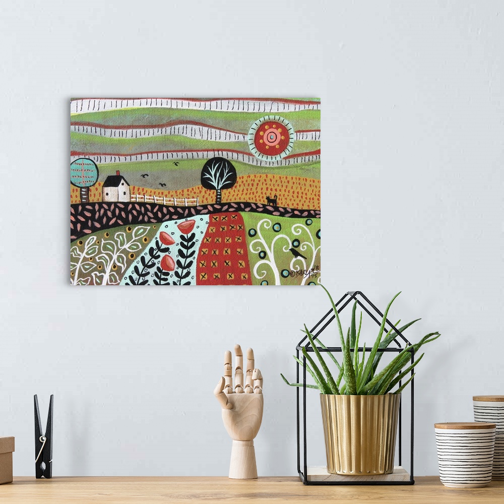 A bohemian room featuring Contemporary folk-art style painting of a rolling hill landscape with houses and patchwork fields.