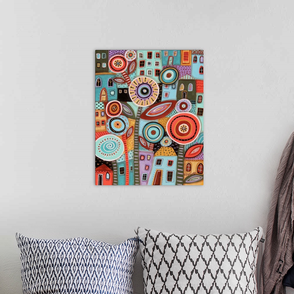 A bohemian room featuring A contemporary painting of a giant flower against a background of stacked and squished houses.
