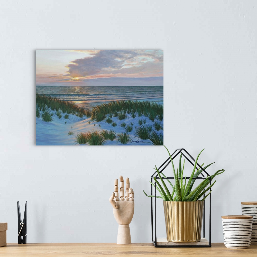 A bohemian room featuring Contemporary painting of the sun setting across the ocean and sand dunes with beach grass.