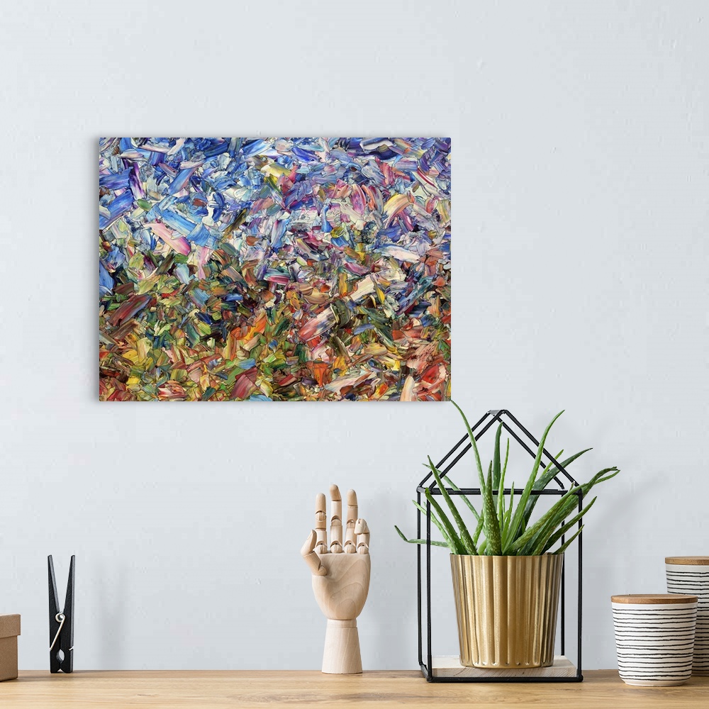 A bohemian room featuring Abstract artwork made of streaks and splatters, resembling flowers in a garden.