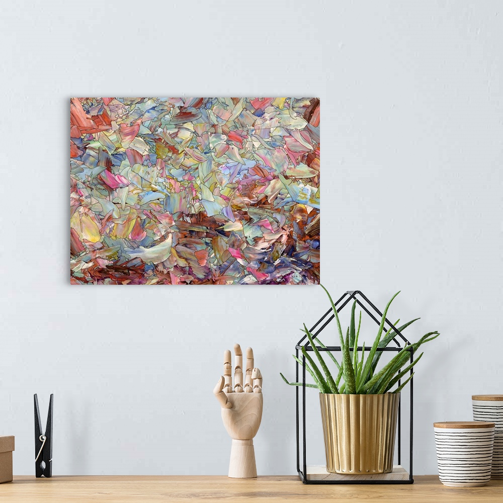A bohemian room featuring Abstract artwork made of streaks and splatters.