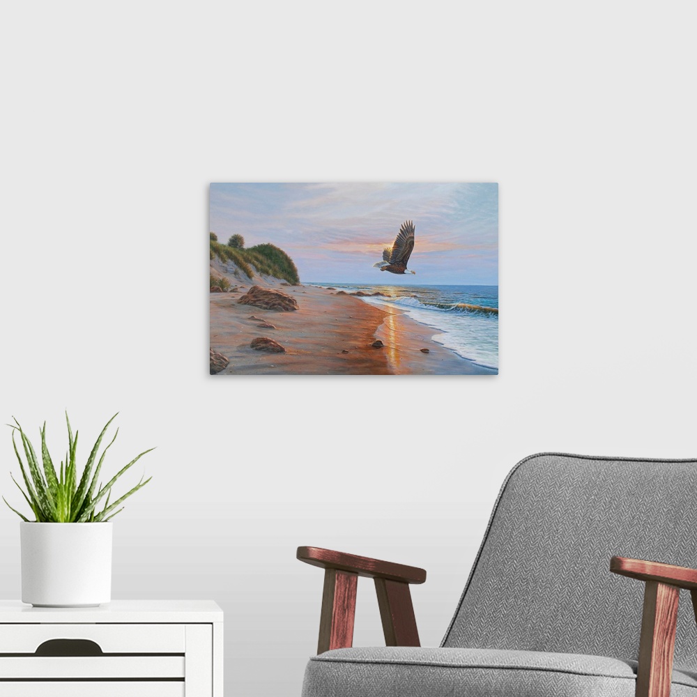 A modern room featuring Contemporary artwork of an Eagle in flight over a beach at sunset