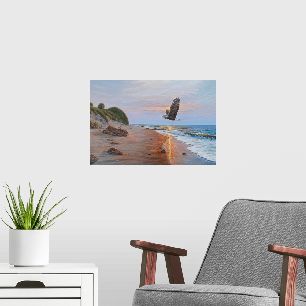 A modern room featuring Contemporary artwork of an Eagle in flight over a beach at sunset